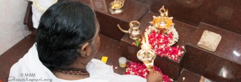 Amma performing puja